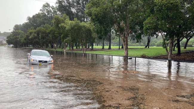 Many cars have been left abandoned in flood waters overnight. Picture: NSW SES