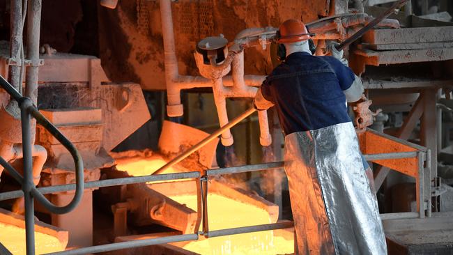 A worker handles molten copper at the at the Glencore Copper Smelter in Mount Isa. Queensland Premier Annastacia Palaszczuk visited the plant as part of her re-election campaign. Queenslanders will go to the polls on October 31. Picture: NCA NewsWire / Dan Peled