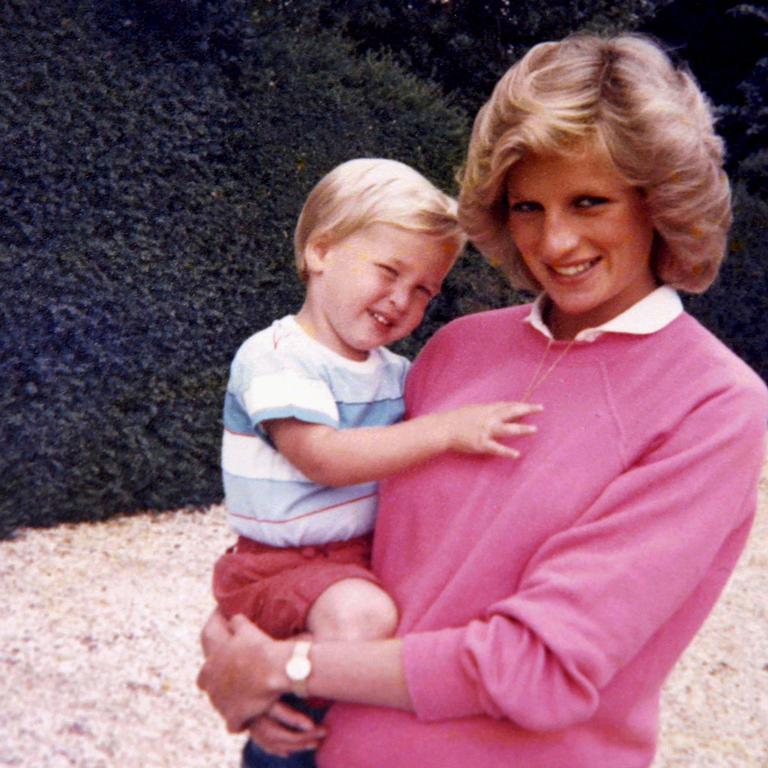 Diana, Princess of Wales holding Prince William while pregnant with Harry. Picture: AFP/Kensington Palace