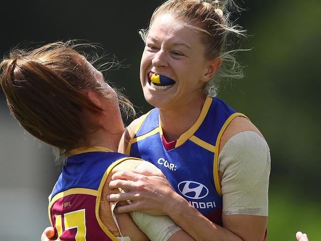 BRISBANE, AUSTRALIA - MARCH 11: Kate McCarthy of the Lions celebrates a goal during the round six AFL Women's match between the Brisbane Lions and the Western Bulldogs at South Pine Sports Complex on March 11, 2017 in Brisbane, Australia. (Photo by Chris Hyde/AFL Media/Getty Images)