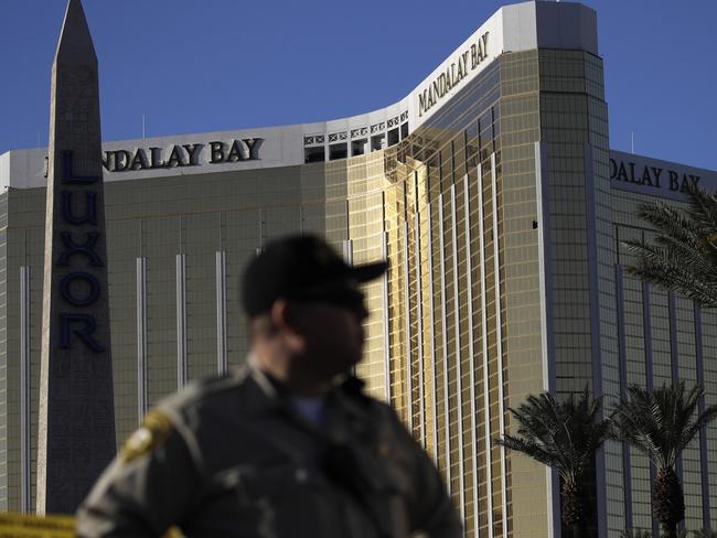 A Las Vegas police officer stands by a blocked off area near the Mandalay Bay casino in Las Vegas, two days after the October 1 shooting which left at least 58 people dead. Picture: John Locher/AP