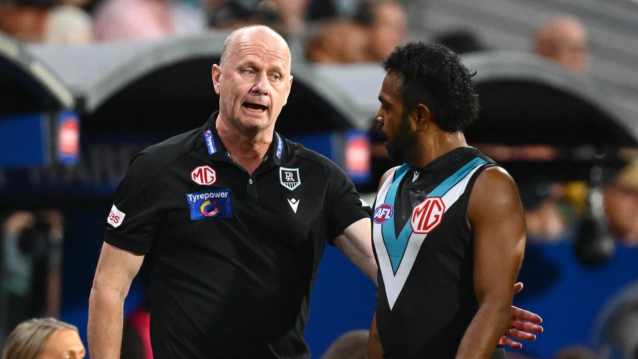 Port coach Ken Hinkley speaks to Willie Rioli, who is under fire for allegedly threatening rival players. Picture: Quinn Rooney/Getty Images