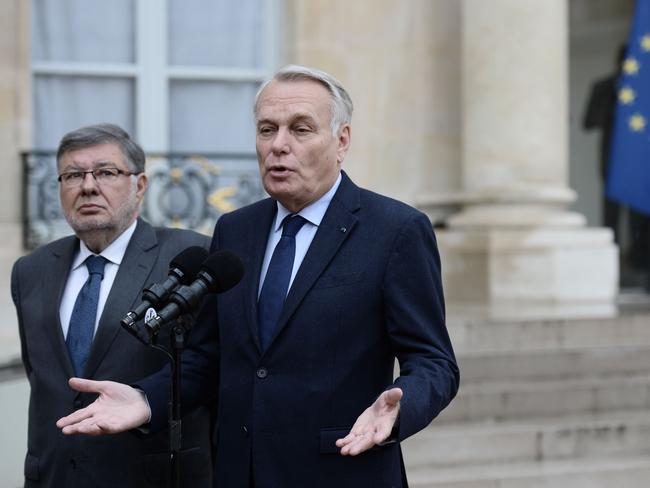 French Foreign minister Jean-Marc Ayrault speaks to journalists following a crisis meeting of top ministers at the Elysee Presidential palace in Paris.