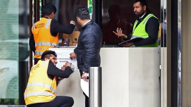 United Security guards stationed at the doors outside quarantine hotel Crown Promenade, in Melbourne’s Southbank. Picture: Aaron Francis.