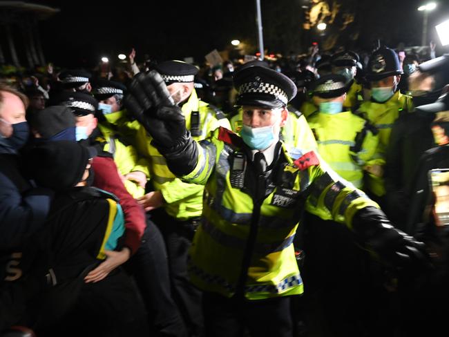 Police officers clash with mourners at the vigil on Clapham Common. Picture: Getty Images