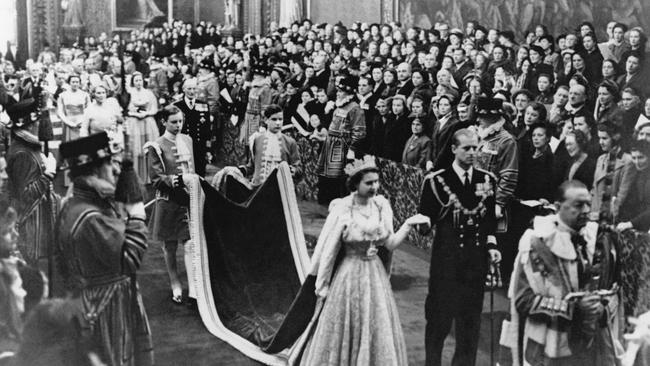 Queen Elizabeth II and the Duke of Edinburgh during the first opening of parliament of the Queen's reign in 1952. Picture: Getty Images.