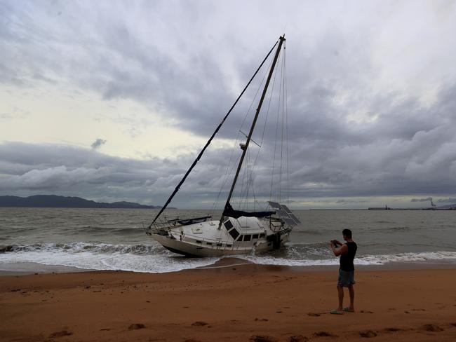 Townsville locals including Dr Deepak Doshi woke early to inspect the damage along The Strand left from TC Kirrily that hit overnight. Pics Adam Head