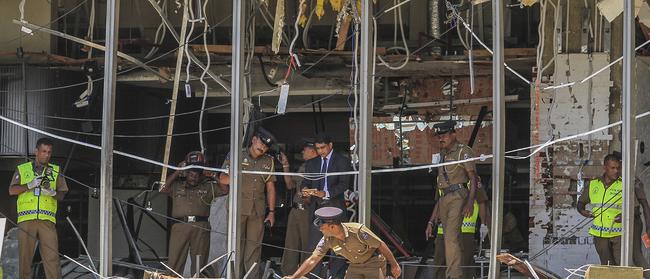 Police inspect the Shangri-la hotel in Colombo, Sri Lanka, on Easter Sunday. Picture: AP/Chamila Karunarathne