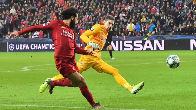 Liverpool’s Mohamed Salah scores against RB Salzburg in their Champions League game