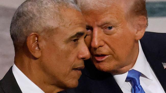 WASHINGTON, DC - JANUARY 09: Former U.S. President Barack Obama (L) and U.S. President-elect Donald Trump visit while attending the state funeral for former U.S. President Jimmy Carter with former first lady Melania Trump, Vice President Kamala Harris and second gentleman Doug Emhoff at Washington National Cathedral on January 09, 2025 in Washington, DC. President Joe Biden declared today a national day of mourning for Carter, the 39th President of the United States, who died at the age of 100 on December 29, 2024 at his home in Plains, Georgia.   Chip Somodevilla/Getty Images/AFP (Photo by CHIP SOMODEVILLA / GETTY IMAGES NORTH AMERICA / Getty Images via AFP)