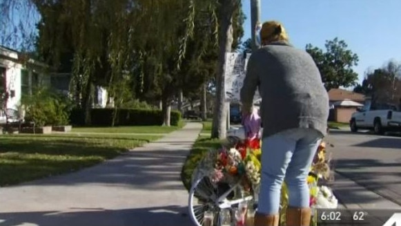 Family gather at the crash site in Los Angeles. Picture: NBCLA