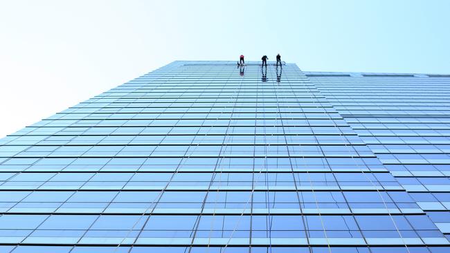 Reporter Heather McNab starts the descent with other adventurous souls for Abseil for Youth. Picture: Craig Greenhill