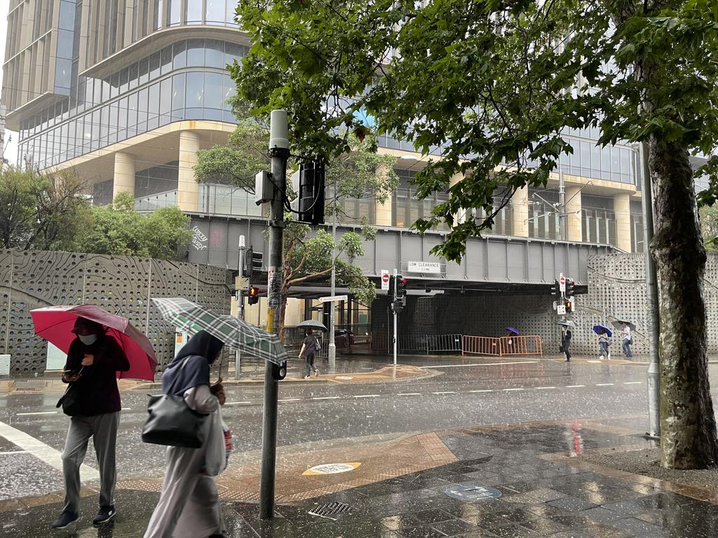 Pedestrians brave the rain outside Westfield Parramatta as Sydney and NSW gets drenched. Picture: Supplied