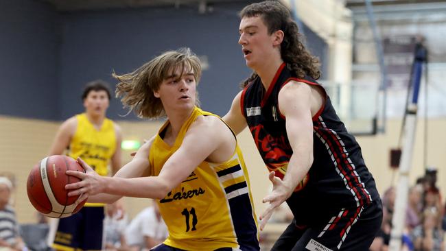 Joshua Holmes of Mount Gambier keeps the ball away from Ty Baudewyns of Mildura during the SA Country Basketball Champs under-18s boys division 1. Picture: Kelly Barnes/AllStar Photos