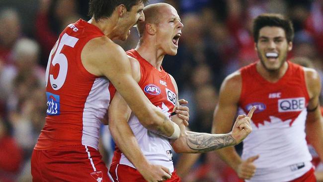 MELBOURNE, AUSTRALIA - MAY 14: Zak Jones (C) of the Swans celebrates a goal during the round eight AFL match between the North Melbourne Kangaroos and the Sydney Swans at Etihad Stadium on May 14, 2017 in Melbourne, Australia. (Photo by Michael Dodge/Getty Images)