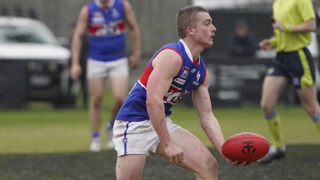 Matt O’Brien shoots off a handball. Picture: Valeriu Campan