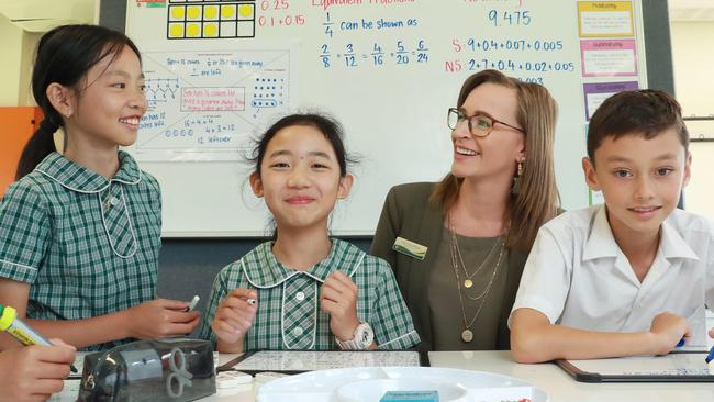 Carlingford West Public School Year 4 pupils Yeh Huynh, Sunny Sun and Callum Whealey, and teacher Serena Wright. Picture: John Feder