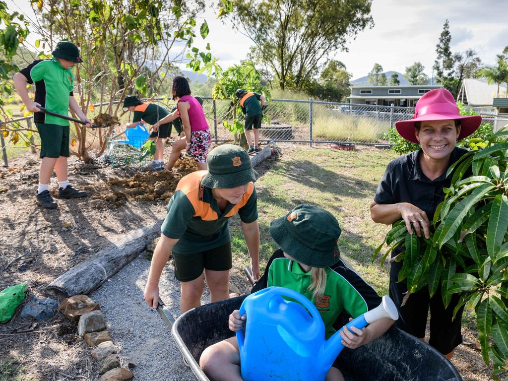 News The Australian, 3.5.2018 Yarwun QLD, Joint principal Amanda Ryan happy to be in the garden at Yarwun State School with Ben Dunphy and Abi Hartley in the wheelbarrow. Photo Paul Beutel