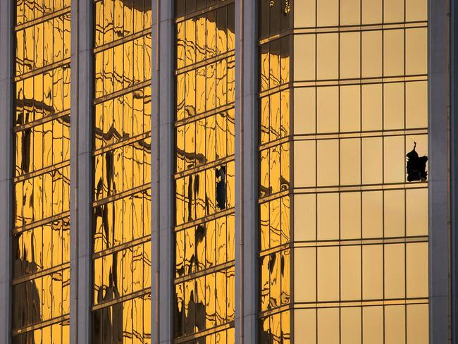 A broken window on the 32nd floor of the Mandalay Bay Resort and Casino where Paddock opened fire on concertgoers below. Picture: Drew Angerer/Getty Images/AFP