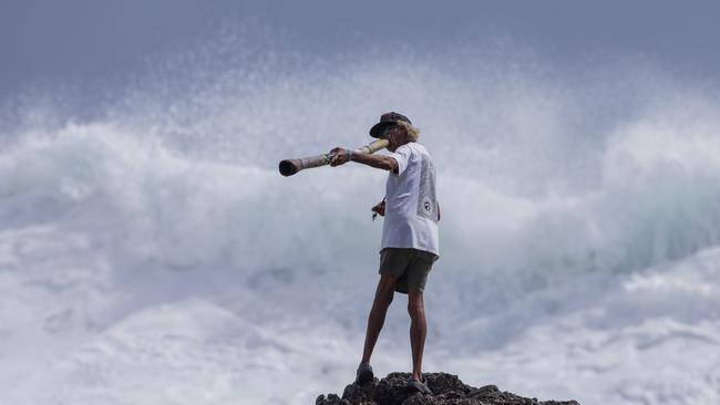 Snapper Rocks local Aboriginal identity Russell Corowa blessing the ocean on Sunday 2 January 2022. Picture: Jerad Williams