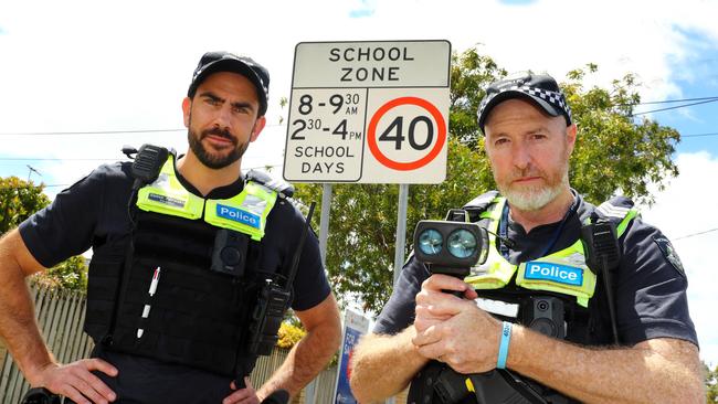 Geelong Highway Patrol Sergeant Damon Patralakis, left, and Acting Sergeant Jamie Davidson patrolling 40km/h school zones. Picture: Alison Wynd