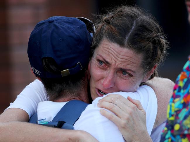 Lismore’s Melanie James is consoled by a friend after she confronted Premier Dominic Perrottet during a visit to flood affected Coraki. She was upset about not enough help on the ground. Picture: Toby Zerna