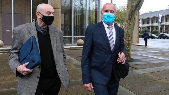 Chris Dawson, right, leaves the Supreme Court of New South Wales in Sydney with his brother on Monday. Picture Gaye Gerard