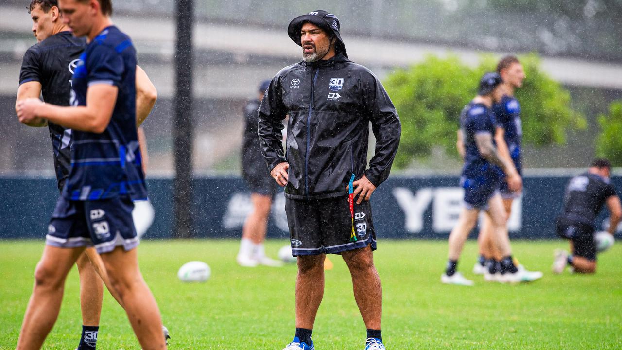 Coach Todd Payten keeping a close eye on proceedings in the wet weather. Photo Cowboys