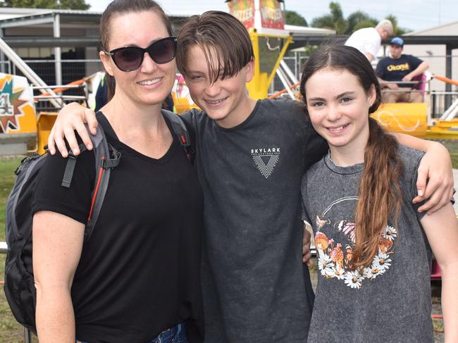 Mum Hayley Ridley was squished right up next to her two children Pheonix and Artaya as the ride spun them around and around. Picture: Lillian Watkins