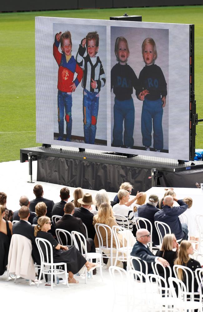 A video tribute is played during Troy Selwood's funeral service.