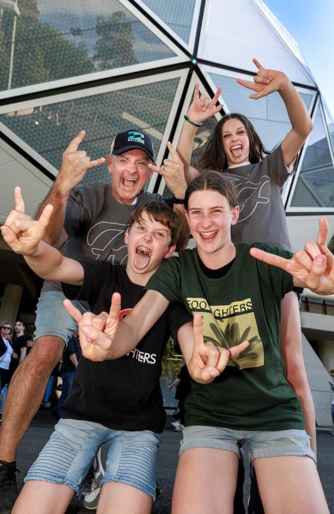 Jason Coleman with his children Michael, 10, Zoe, 12 and Eliza, 14, before the Foo Fighters concert at AAMI Park. Picture: David Geraghty