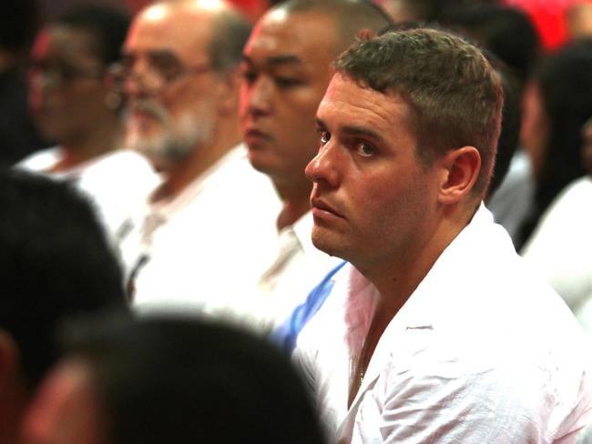 Bali Nine member Matthew Norman sits among the other inmates during the Christmas remission announcement inside Kerobokan jail in Bali. Picture: Lukman S. Bintoro