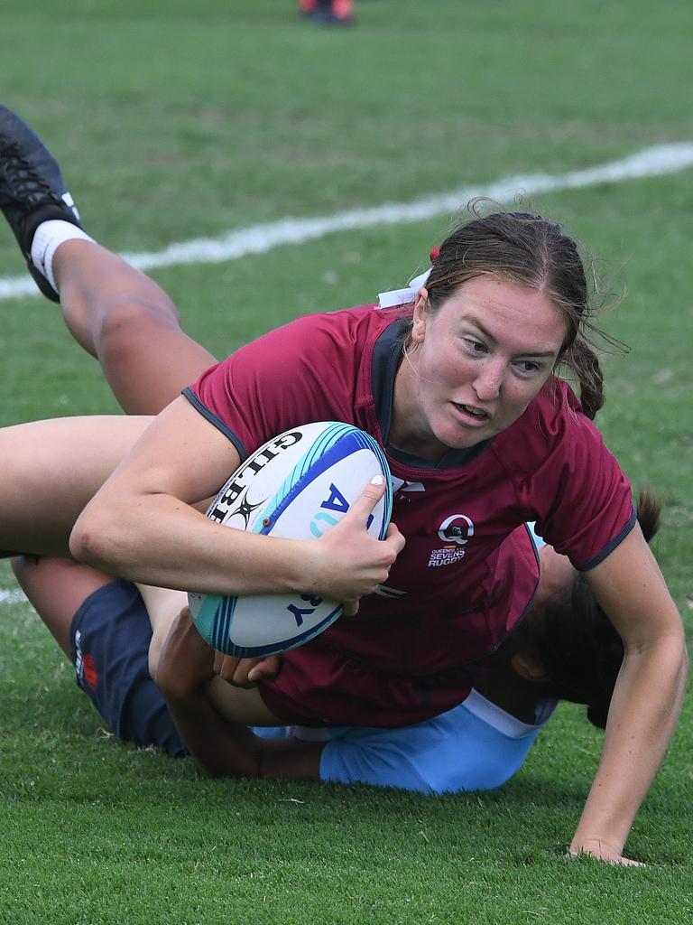 Queensland player Amy Brice caught from behind at the National Youth Sevens Cup at Sunshine Coast Stadium.