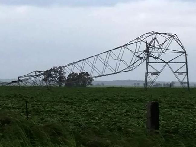 Transmission towers toppled by high winds near Melrose in South Australia, September 2016. Picture: AFP/Debbie Prosser