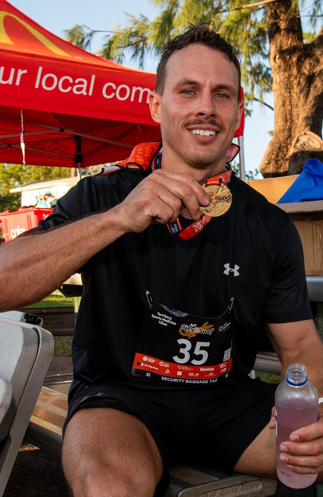 Mathew Flanegan posing with his finishers medal. Picture: Pema Tamang Pakhrin.