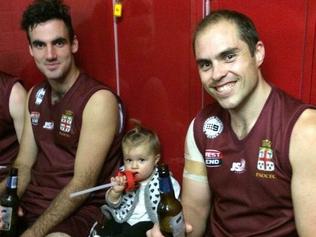 Daddy’s brave little girl wins hearts of footy mates