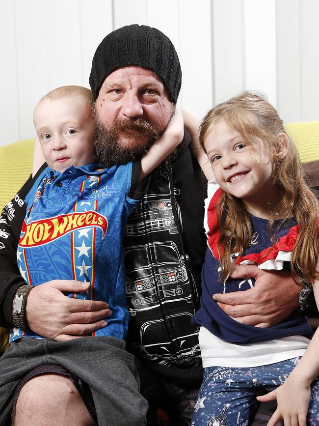 Mr Barrow with his children Seth, 5, and Lily, 6. Picture: AAP/Josh Woning