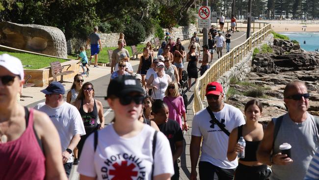 Crowds at Shelly Beach and the coastal walking path at Manly on Sunday.