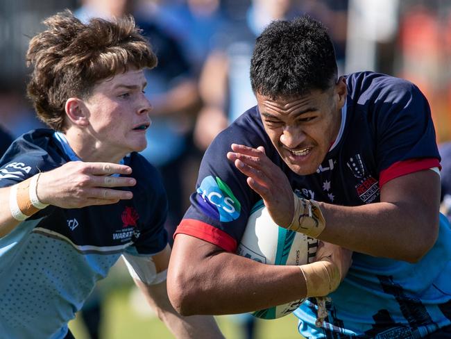 20th September 2022. News Local. SportDaceyville, Sydney, NSW, Australia.Pics by Julian Andrews.Rugby Union Action from the NSW Waratahs Under 18 team v Melbourne Rebels.Picture shows:WaratahÃs player(s):  Joey Fowler tacklesRebels player(s): Captain Leafi Talataina