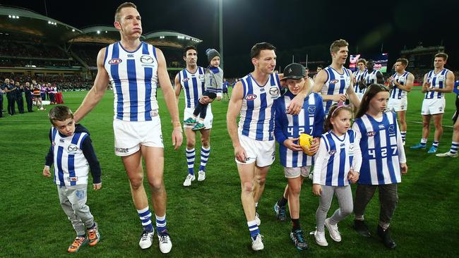 Drew Petrie, Michael Firrito, Brent Harvey and Nick Dan Santo are clapped off.