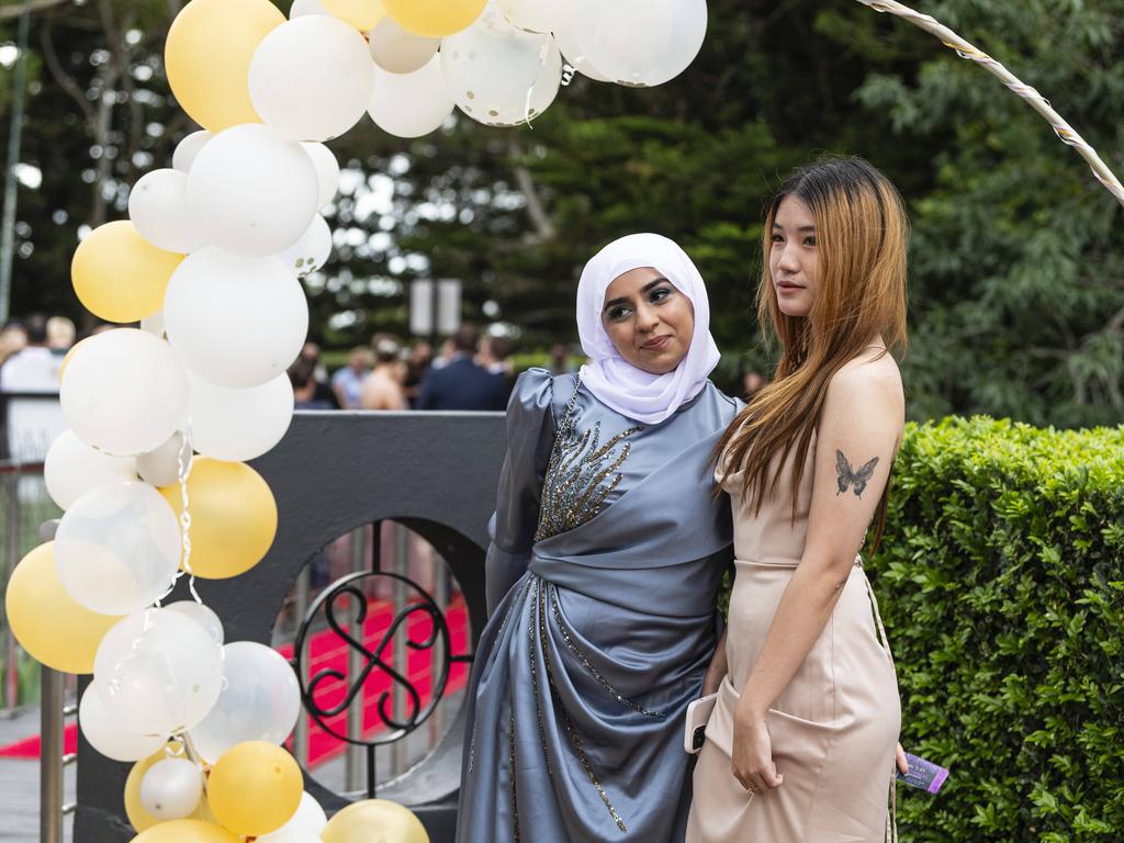 Zahraa Kiream (left) and An Nguyen at Centenary Heights State High School formal at Picnic Point, Friday, November 15, 2024. Picture: Kevin Farmer