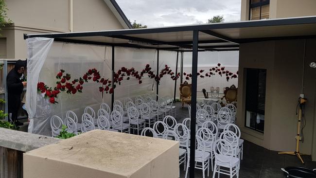 Wedding ceremony preparations in the backyard. Picture: Steve Tyson