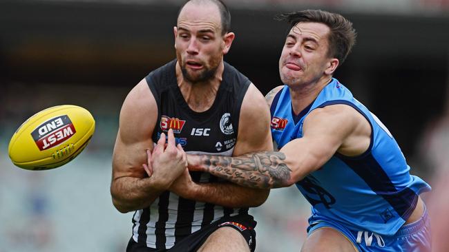 Sturt's Jake Sutcliffe battles Port Adelaide’s Matthew Broadbent. Picture: TOM HUNTLEY