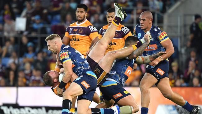 Bryce Cartwright of the Titans tackles Matthew Lodge. Picture: AAP Image