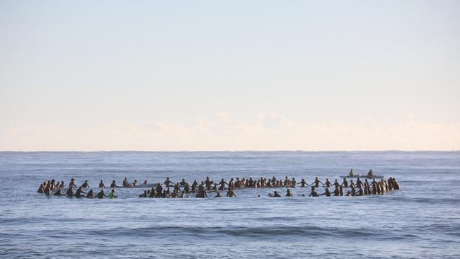 Members of the public took part in a paddle-out at Byron Bay's Main Beach to protest against the planned Netflix reality show Byron Baes on the morning of Tuesday, April 20, 2021. Picture: Liana Boss