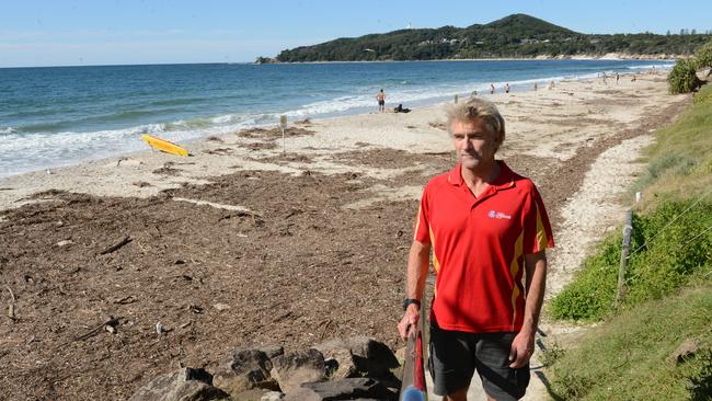 Byron Bay lifeguard supervisor Steve Mills at Main Beach Byron Bay. Erosion has impacted the shoreline from Main Beach to Clarkes Beach. The beaches have been closed and debris is strewn along what remains of the sand.