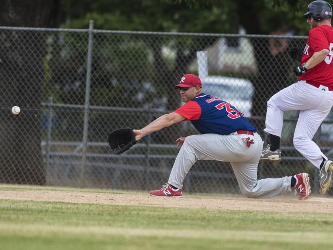 Carina Redsocks White player Kyle Ostapouich (right) is safe at first from Brian Hipps of Toowoomba Rangers in GBL division four baseball at Commonwealth Oval, Sunday, February 7, 2021. Picture: Kevin Farmer