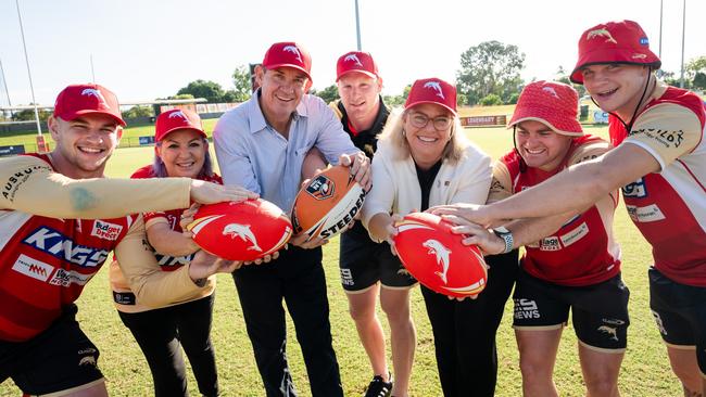 Dolphins players Oryn Keely, Thomas Flegler, Harrison Graham and James Walsh with ministers Robyn Cahill, Gerard Maley and Marie-Clare Boothby.