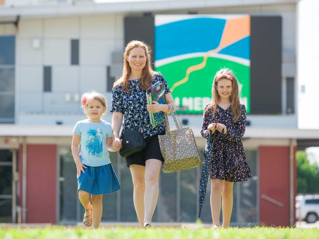 Palmerston Mum Michelle Tomlinson with her daughters Annika 5 and Ava 8 Schreiner , in Goyder Square .Picture GLENN CAMPBELL