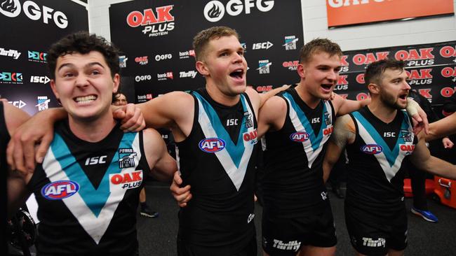 Darcy Byrne-Jones, Dan Houston, Ollie Wines and Sam Gray since the song after the victory over the Swans. Picture: David Mariuz/AAP.